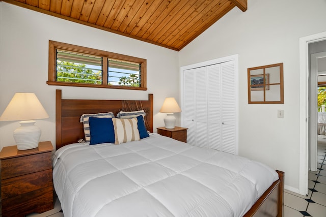 bedroom featuring vaulted ceiling with beams, a closet, and wooden ceiling