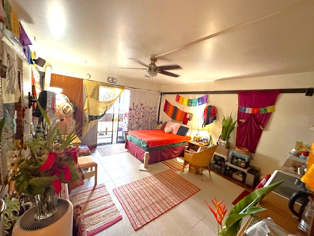 bedroom with ceiling fan and light tile patterned floors