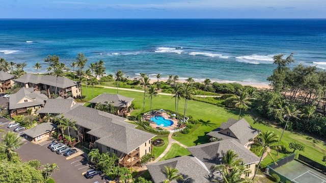 drone / aerial view featuring a water view and a beach view