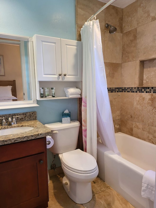 full bathroom with vanity, tile patterned flooring, toilet, and shower / bath combo with shower curtain