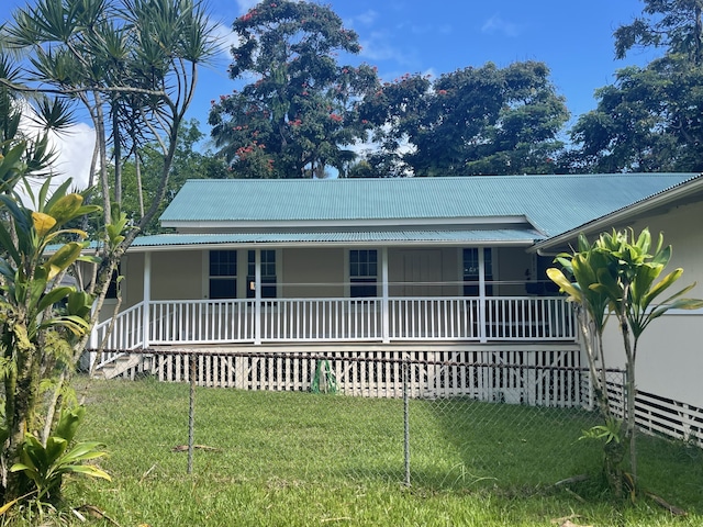 view of front facade with covered porch and a front yard