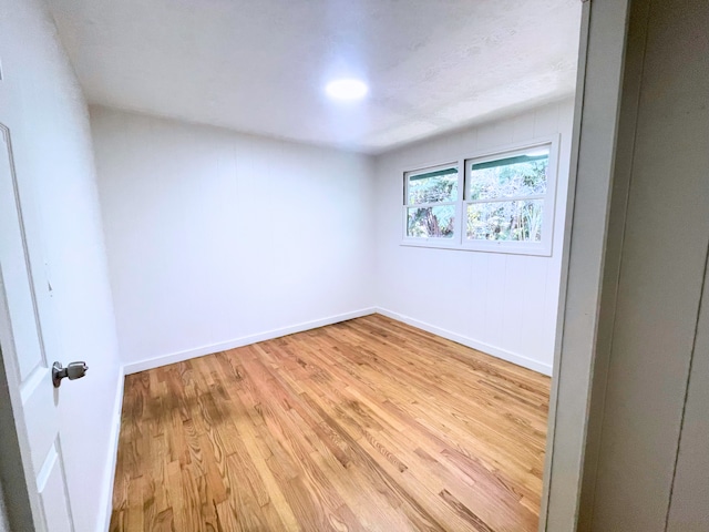 spare room featuring light hardwood / wood-style floors