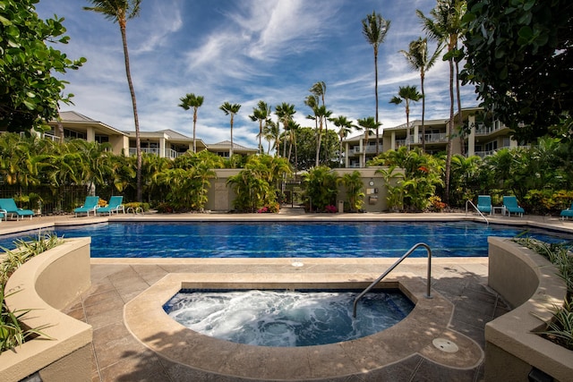 view of pool featuring a patio and a community hot tub