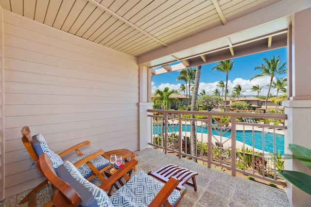 view of patio / terrace with a fenced in pool