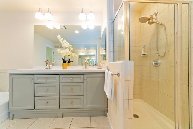 bathroom with tile patterned floors, separate shower and tub, and double sink vanity