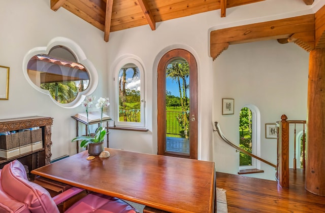 dining space with beamed ceiling, wood-type flooring, wood ceiling, and high vaulted ceiling