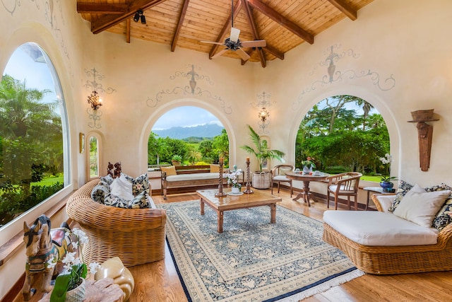 view of patio / terrace featuring ceiling fan, a mountain view, and an outdoor hangout area