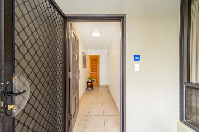 hallway with light tile patterned floors