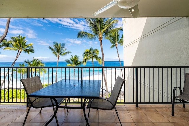 balcony with a view of the beach and a water view