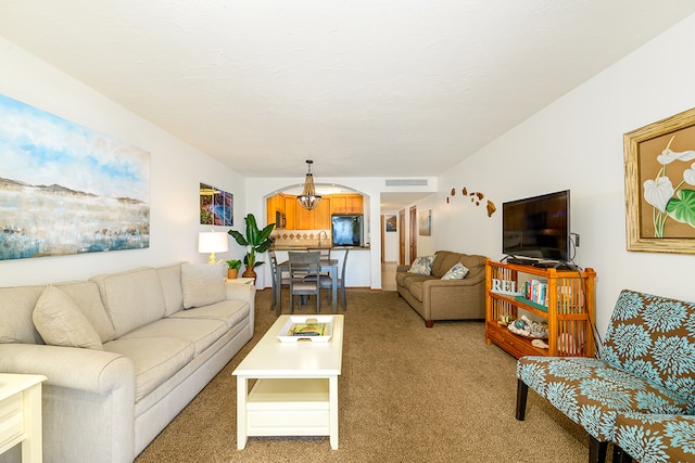 living room featuring sink and carpet flooring