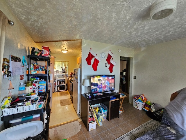 rec room featuring a textured ceiling