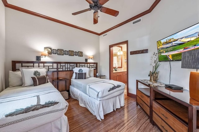 bedroom with hardwood / wood-style floors, ceiling fan, ornamental molding, and ensuite bathroom