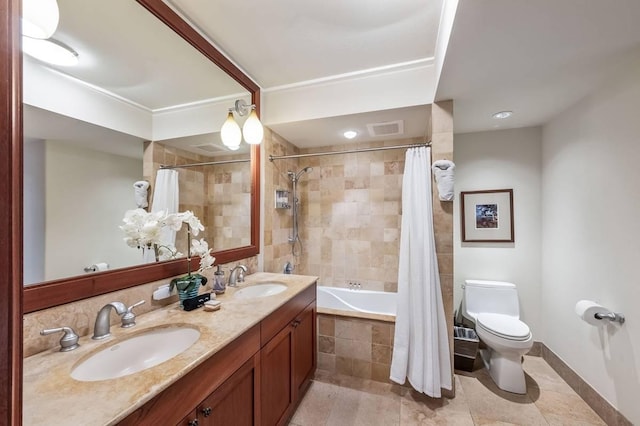 full bathroom featuring shower / bath combo with shower curtain, vanity, and toilet