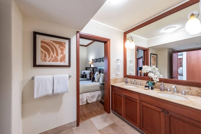 bathroom featuring vanity and crown molding