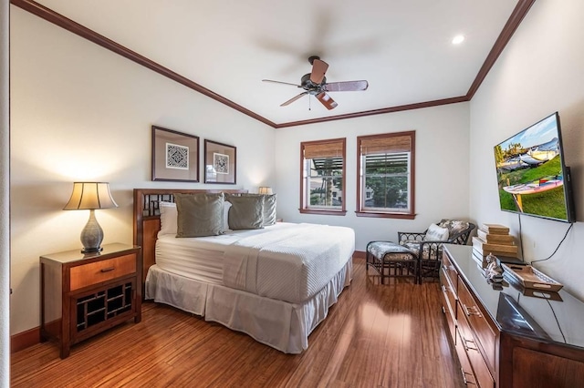 bedroom featuring hardwood / wood-style flooring, ceiling fan, and crown molding