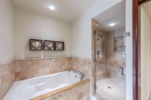 bathroom with separate shower and tub