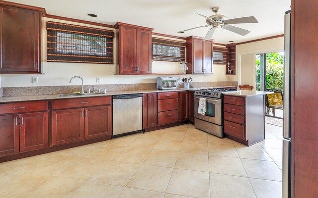 kitchen with sink, ceiling fan, appliances with stainless steel finishes, light stone counters, and kitchen peninsula