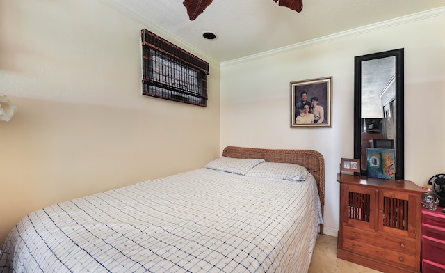 tiled bedroom with ceiling fan and ornamental molding