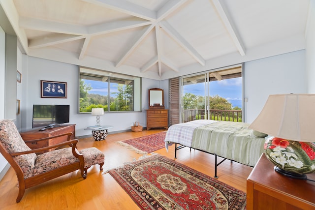 bedroom featuring lofted ceiling with beams, access to outside, and wood-type flooring