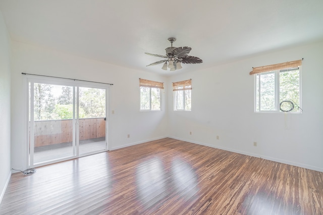 unfurnished room with ceiling fan and hardwood / wood-style flooring