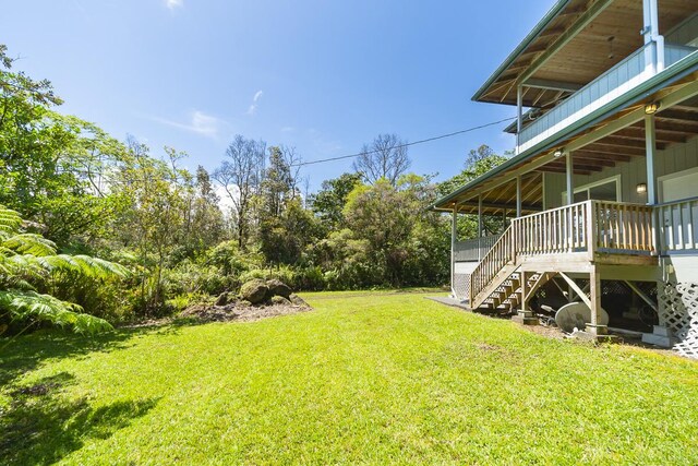 view of yard featuring a wooden deck