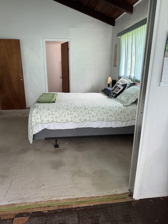 bedroom featuring wood ceiling and vaulted ceiling with beams