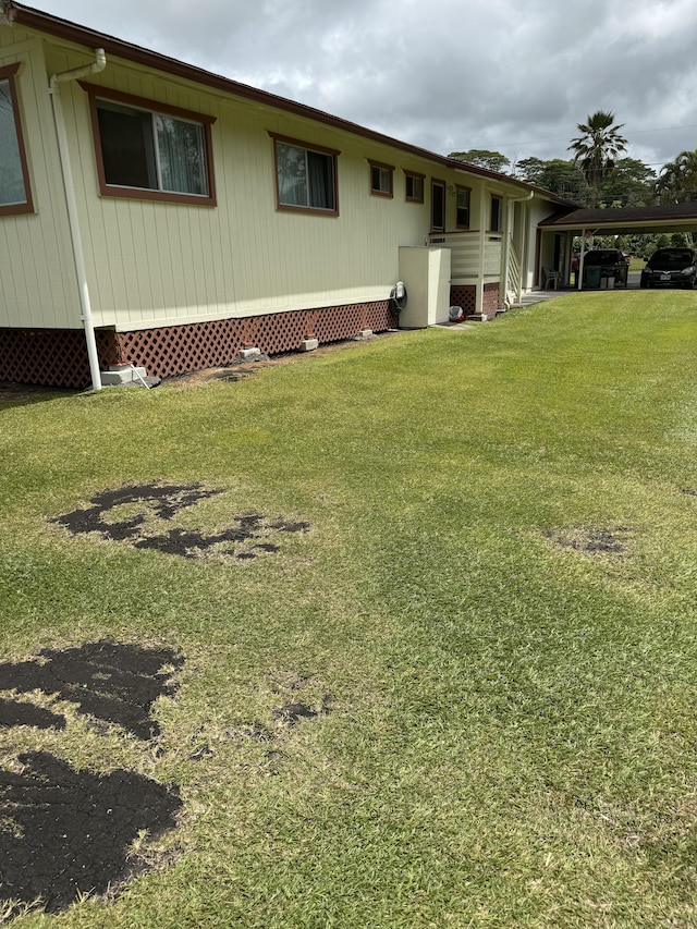 view of yard with a carport