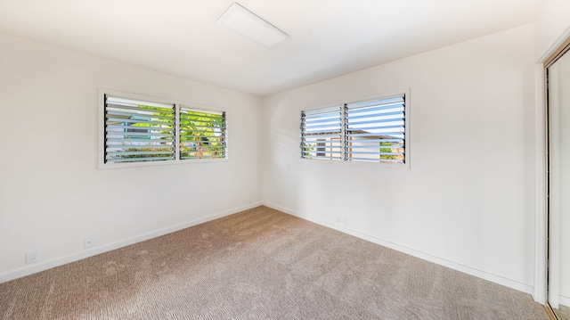 unfurnished room with carpet