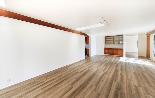 unfurnished living room with light hardwood / wood-style floors