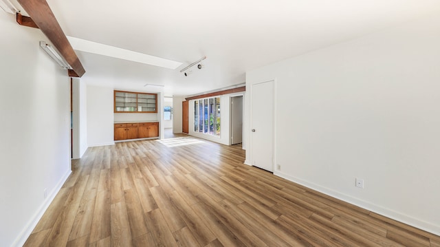 unfurnished living room featuring light hardwood / wood-style flooring