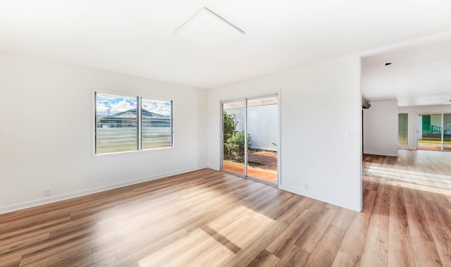 unfurnished room with light hardwood / wood-style floors