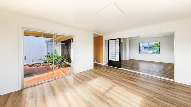 spare room featuring light wood-type flooring