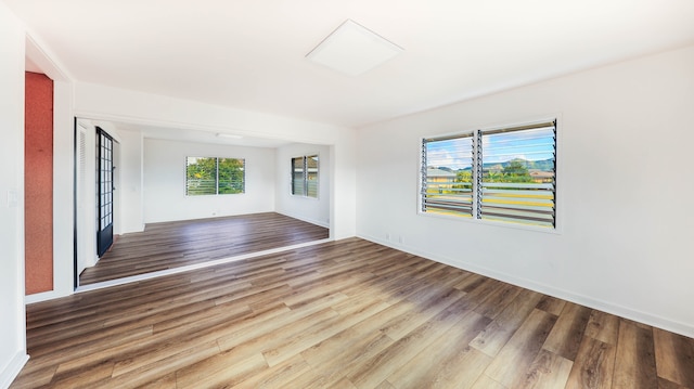 unfurnished living room featuring hardwood / wood-style floors