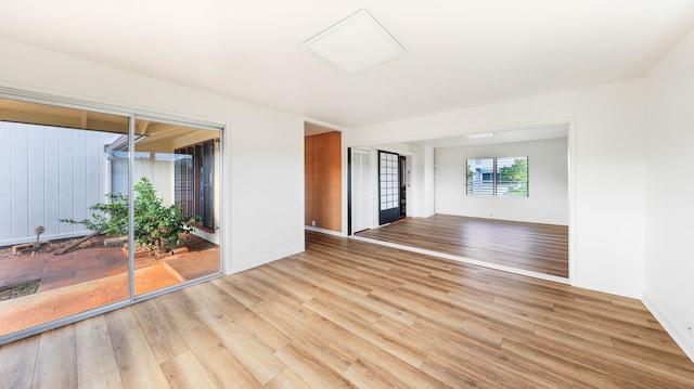 unfurnished room with light hardwood / wood-style flooring