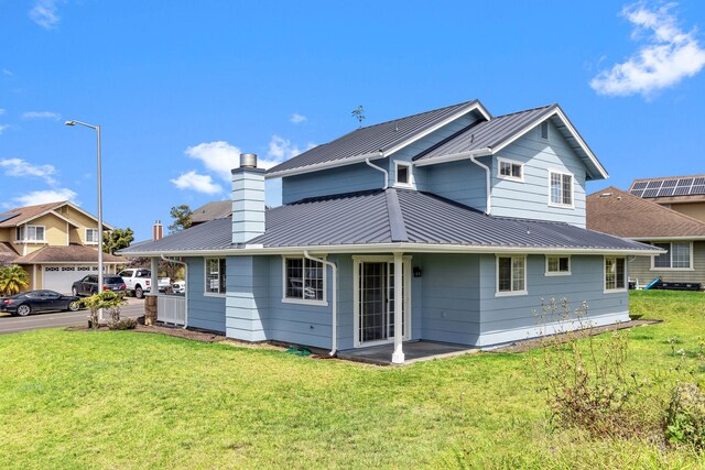 exterior space with a garage and a yard