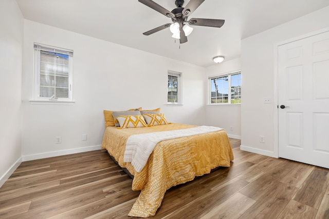 bedroom featuring ceiling fan and wood-type flooring