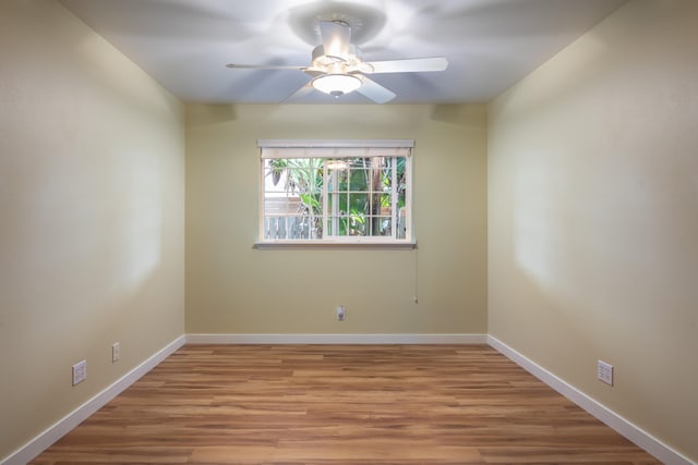 spare room featuring ceiling fan and light hardwood / wood-style floors