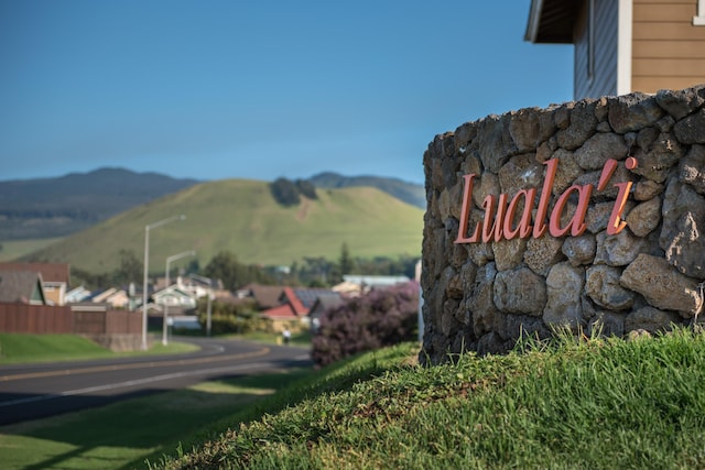 community sign featuring a mountain view