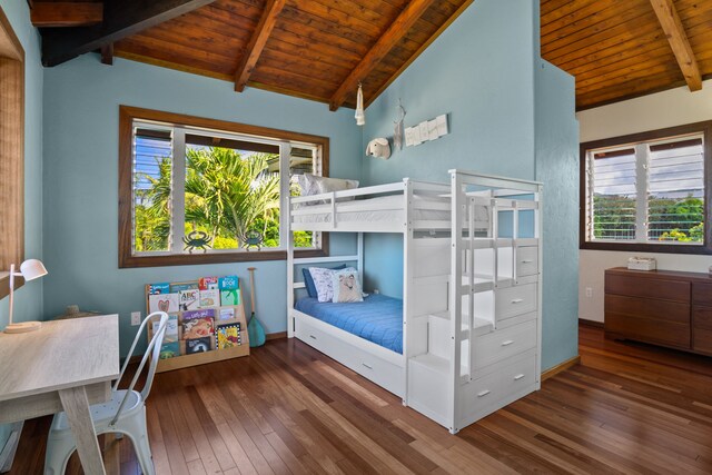 bedroom featuring dark wood-type flooring, vaulted ceiling with beams, and wood ceiling