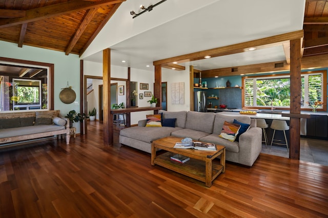 living room with vaulted ceiling with beams, wooden ceiling, and dark hardwood / wood-style floors