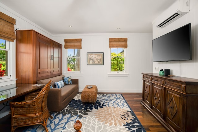 sitting room featuring crown molding, dark hardwood / wood-style floors, and a wall mounted air conditioner