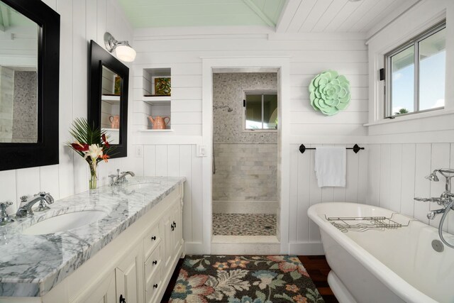 bathroom featuring vanity and shower with separate bathtub