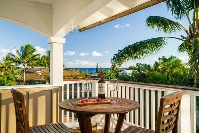 balcony featuring a water view