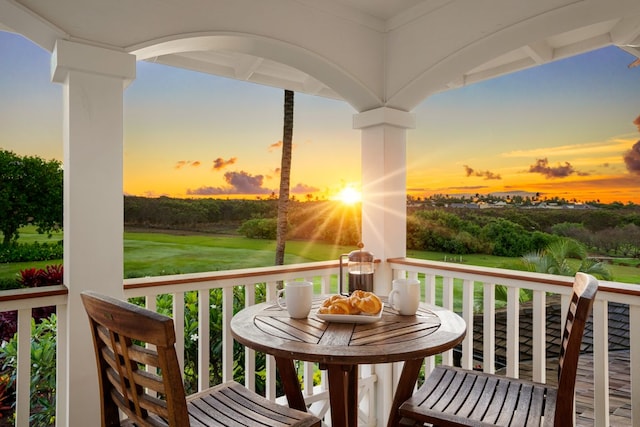 view of balcony at dusk