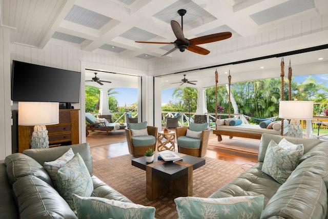 living room with hardwood / wood-style flooring, coffered ceiling, and beam ceiling