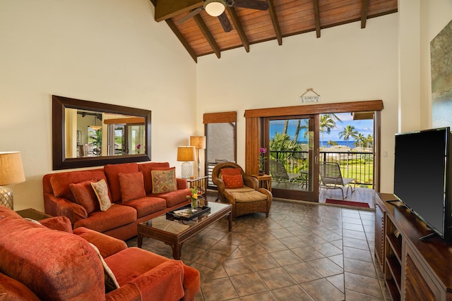 tiled living room featuring beamed ceiling, ceiling fan, wood ceiling, and high vaulted ceiling