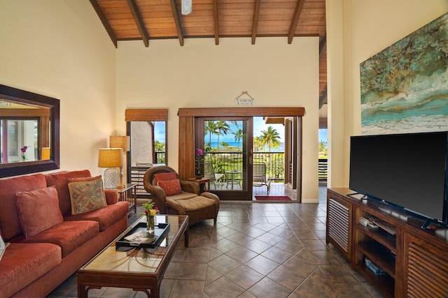 tiled living room with a healthy amount of sunlight, wooden ceiling, beam ceiling, and high vaulted ceiling