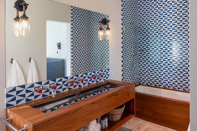 bedroom with wood-type flooring and tile walls