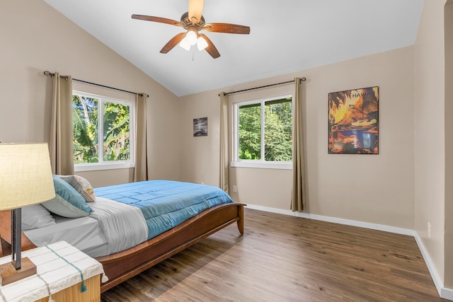 bedroom featuring hardwood / wood-style flooring, ceiling fan, and vaulted ceiling