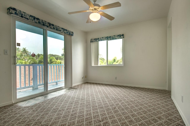 empty room with carpet floors and ceiling fan